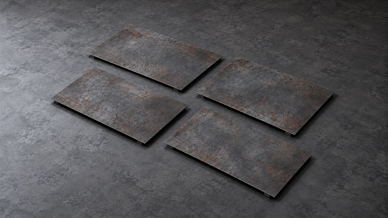 Representative product image: four thin weathering-steel sheets arranged separately in a diagonal grid on a dark floor. Predominantly grey steel with light, patchy surface rust.